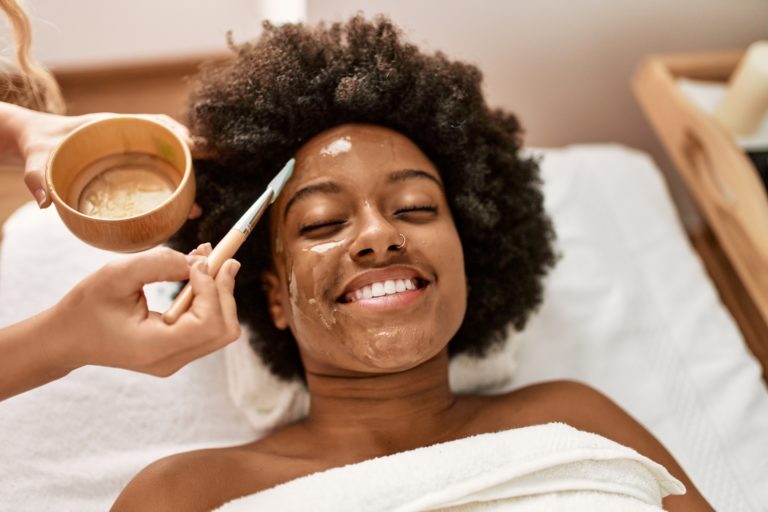 Facial, salon, preparing for a facial, deep cleansing facial, exfoliating, exfoliating facial