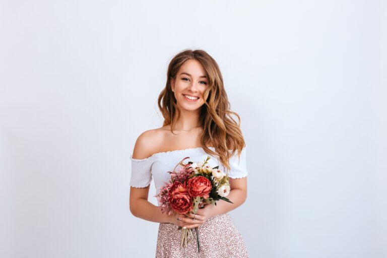 Happy,Young,Woman,With,Long,Curly,Hair,In,A,White