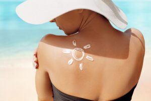 Sun,Protection.,Beauty,Woman,Applying,Sun,Cream,Creme,On,Tanned